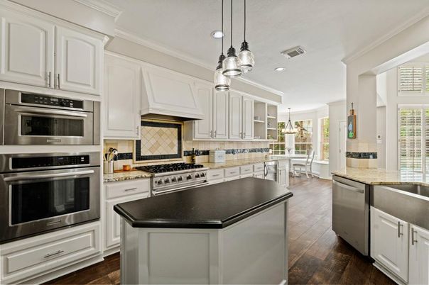Dining room, Interior, Kitchen, Pendant Lights, Recessed Lighting, Stainless Steel Appliances, Wood Texture Flooring