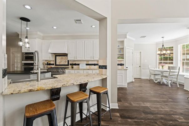Chandelier, Dining room, Interior, Kitchen, Pendant Lights, Recessed Lighting, Stainless Steel Appliances, Wood Texture Flooring