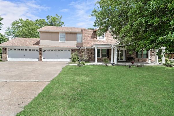 Attached, Backyard, Exterior, Facade, Brick Facade, Split Level