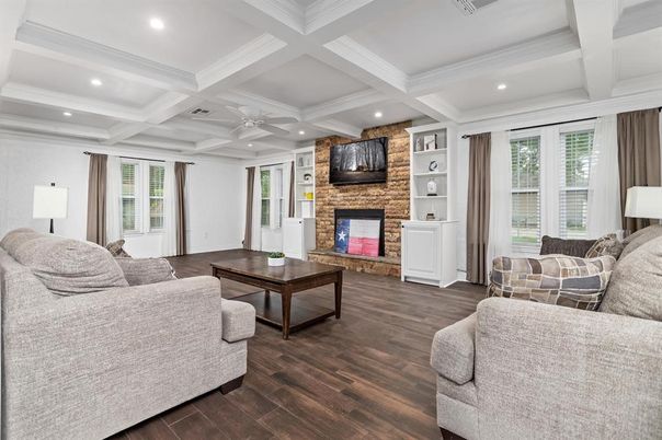 Fireplace, Interior, Living room, Recessed Lighting, Stone Walls, Wood Texture Flooring