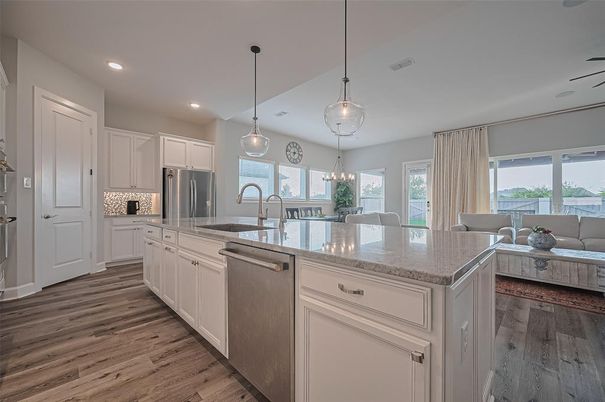 Chandelier, Dining room, Interior, Kitchen, Living room, Pendant Lights, Recessed Lighting, Stainless Steel Appliances, Wood Texture Flooring