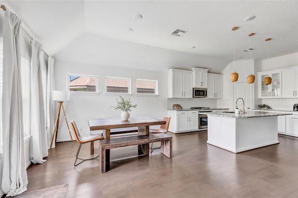 Dining room, Interior, Kitchen, Pendant Lights, Recessed Lighting, Stainless Steel Appliances, Wood Texture Flooring