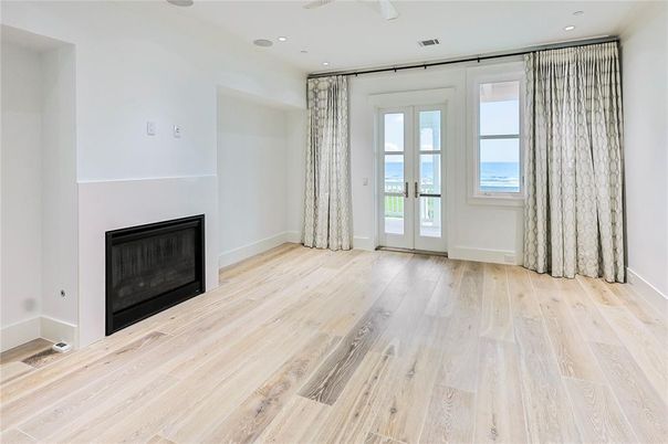 Empty room, Fireplace, Interior, Recessed Lighting, Water, Wood Texture Flooring