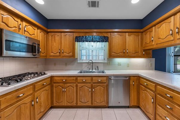 Interior, Kitchen, Recessed Lighting, Stainless Steel Appliances, Tile Countertops