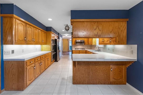Interior, Kitchen, Recessed Lighting, Stainless Steel Appliances, Tile Countertops