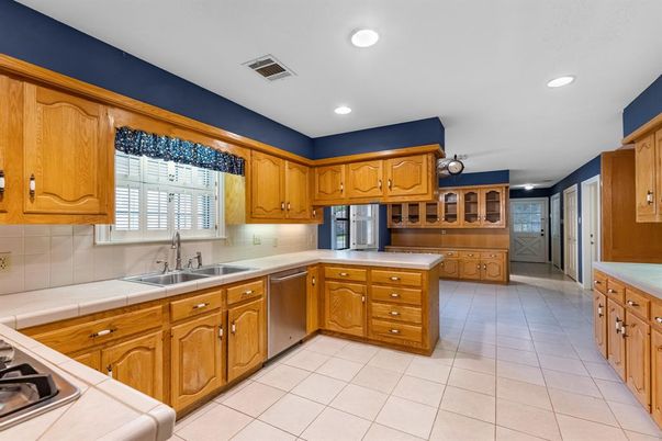 Interior, Kitchen, Recessed Lighting, Stainless Steel Appliances, Tile Countertops