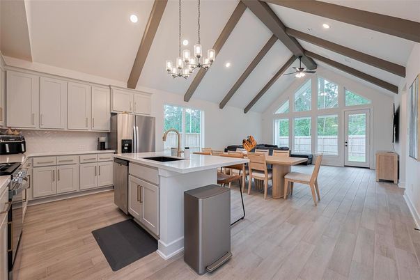 Chandelier, Dining room, Interior, Kitchen, Pendant Lights, Recessed Lighting, Stainless Steel Appliances, Wooden Beams, Wood Texture Flooring