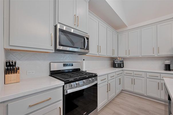 Interior, Kitchen, Stainless Steel Appliances, Tile Countertops, Wood Texture Flooring