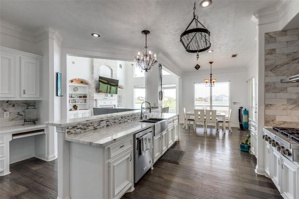 Chandelier, Dining room, Interior, Kitchen, Pendant Lights, Recessed Lighting, Stainless Steel Appliances, Wood Texture Flooring