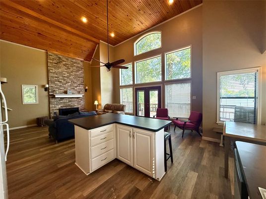 Dining room, Fireplace, Interior, Kitchen, Living room, Recessed Lighting, Stone Walls, Wooden Ceilings, Wood Texture Flooring