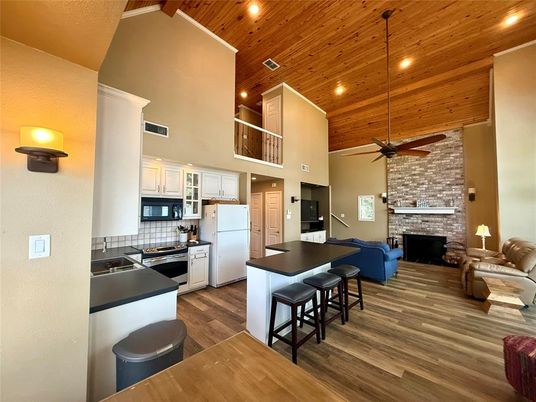 Fireplace, Interior, Kitchen, Living room, Pendant Lights, Recessed Lighting, Stone Walls, Wooden Ceilings, Wood Texture Flooring