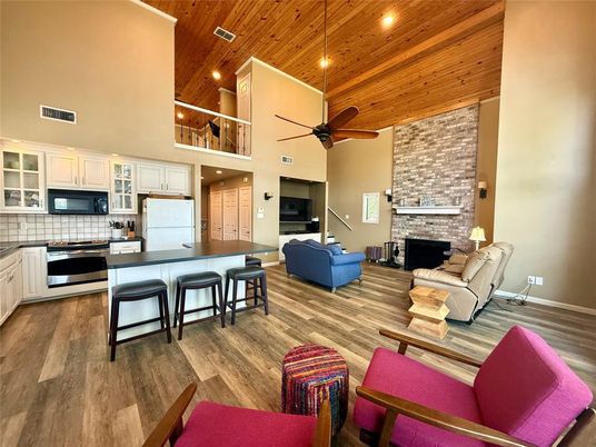 Fireplace, Interior, Kitchen, Living room, Recessed Lighting, Stainless Steel Appliances, Stone Walls, Wooden Ceilings, Wood Texture Flooring