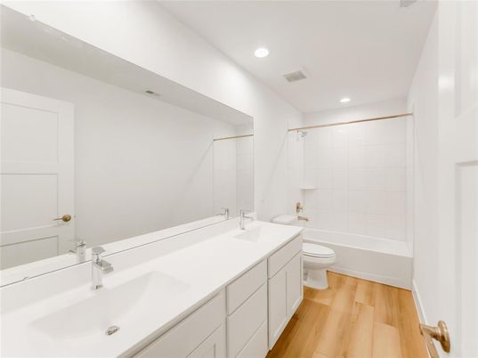 Bathroom, Dual Sink Vanities, Interior, Recessed Lighting, Wood Texture Flooring