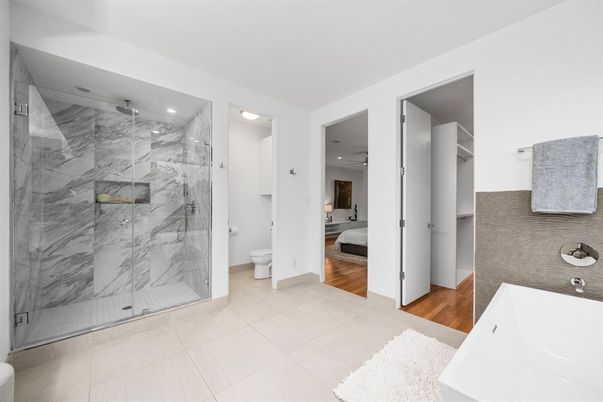 Bathroom, Glass Shower, Interior, Marble Walls, Recessed Lighting, Wood Texture Flooring