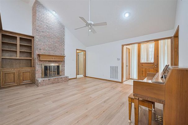 Empty room, Fireplace, Interior, Recessed Lighting, Stone Walls, Wood Texture Flooring