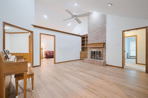Fireplace, Interior, Piano, Recessed Lighting, Stone Walls, Wood Texture Flooring