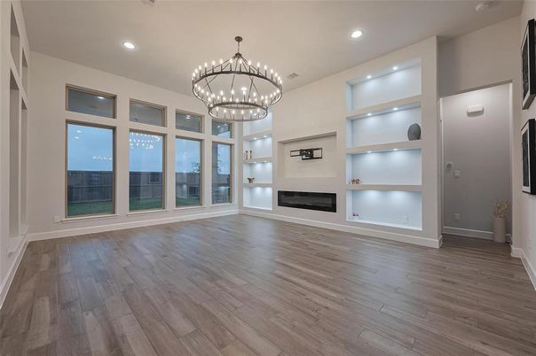 Chandelier, Empty room, Fireplace, Interior, Recessed Lighting, Wood Texture Flooring