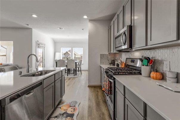 Dining room, Interior, Kitchen, Recessed Lighting, Stainless Steel Appliances, Wood Texture Flooring