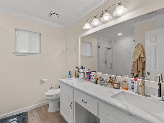 Bathroom, Dual Sink Vanities, Glass Shower, Interior, Marble Walls, Recessed Lighting, Wood Texture Flooring