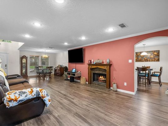 Chandelier, Dining room, Fireplace, Interior, Living room, Pendant Lights, Recessed Lighting, Wood Texture Flooring