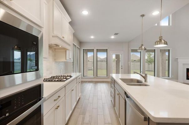 Fireplace, Interior, Kitchen, Pendant Lights, Recessed Lighting, Stainless Steel Appliances, Wood Texture Flooring