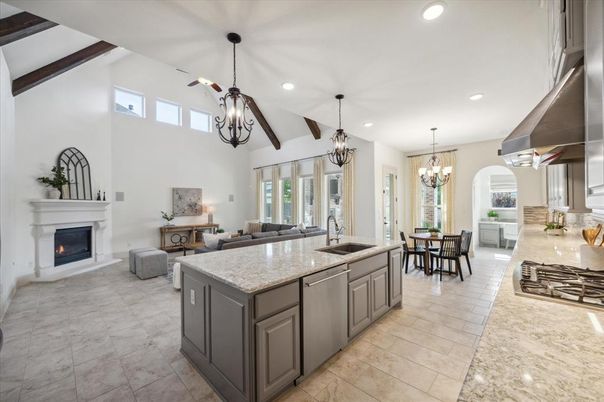 Chandelier, Dining room, Fireplace, Interior, Kitchen, Living room, Pendant Lights, Recessed Lighting, Stainless Steel Appliances, Wooden Beams