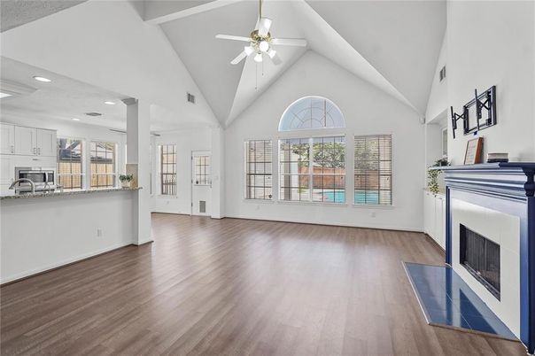 Empty room, Fireplace, Interior, Kitchen, Recessed Lighting, Wood Texture Flooring