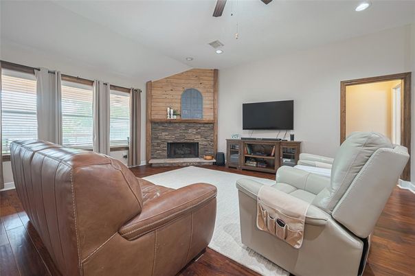 Fireplace, Interior, Living room, Recessed Lighting, Stone Walls, Wood Texture Flooring, Wooden Walls
