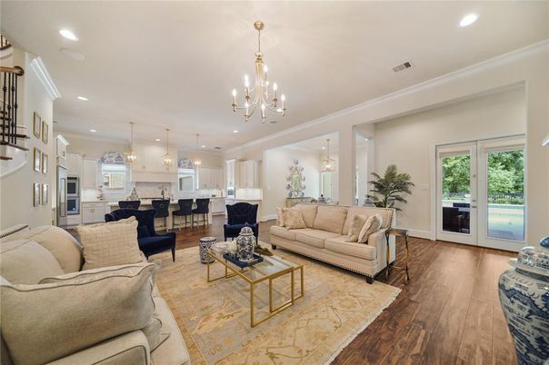 Chandelier, Dining room, Interior, Kitchen, Living room, Pendant Lights, Recessed Lighting, Stainless Steel Appliances, Wood Texture Flooring