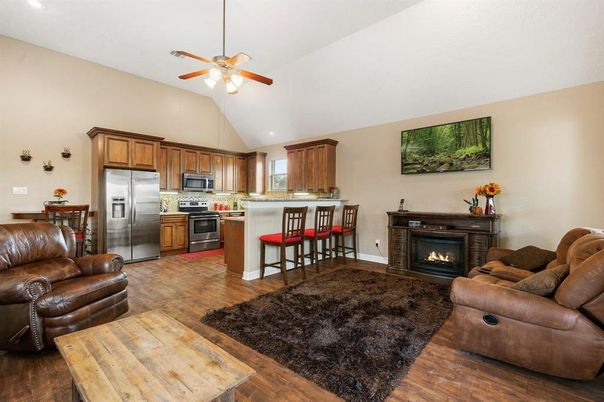 Fireplace, Interior, Kitchen, Living room, Recessed Lighting, Stainless Steel Appliances, Wood Texture Flooring