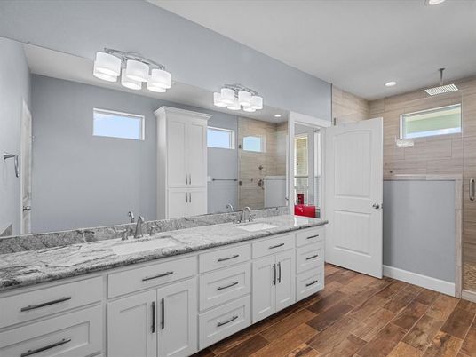 Bathroom, Dual Sink Vanities, Glass Shower, Interior, Recessed Lighting, Wood Texture Flooring