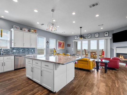 Chandelier, Dining room, Fireplace, Interior, Kitchen, Living room, Pendant Lights, Recessed Lighting, Stainless Steel Appliances, Wood Texture Flooring