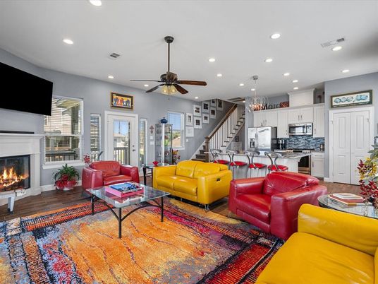 Chandelier, Fireplace, Interior, Kitchen, Living room, Pendant Lights, Recessed Lighting, Stainless Steel Appliances, Wood Texture Flooring