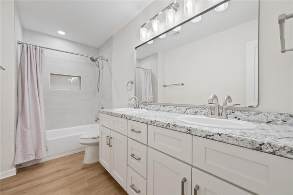 Bathroom, Dual Sink Vanities, Interior, Recessed Lighting, Wood Texture Flooring