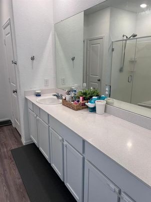 Bathroom, Dual Sink Vanities, Glass Shower, Interior, Recessed Lighting, Wood Texture Flooring