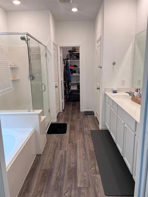 Bathroom, Dual Sink Vanities, Glass Shower, Interior, Recessed Lighting, Walk-in Closets, Wood Texture Flooring