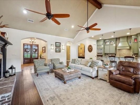 Chandelier, Fireplace, Interior, Kitchen, Living room, Pendant Lights, Recessed Lighting, Stainless Steel Appliances, Wooden Beams, Wood Texture Flooring