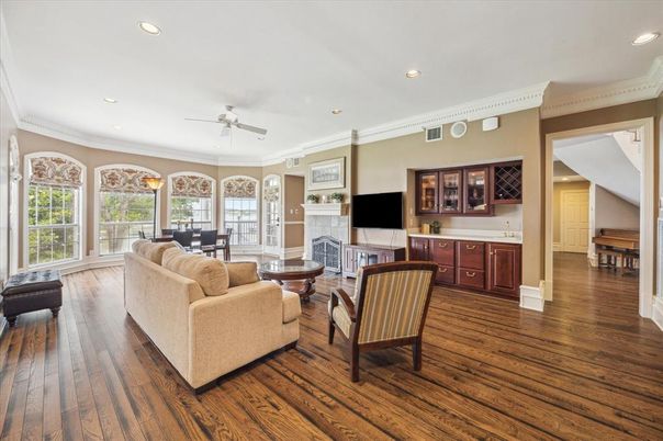 Dining room, Fireplace, Interior, Living room, Recessed Lighting, Wood Texture Flooring