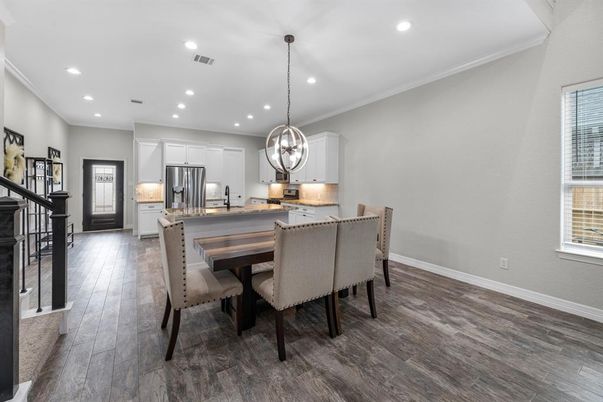 Chandelier, Dining room, Interior, Kitchen, Pendant Lights, Recessed Lighting, Stainless Steel Appliances, Wood Texture Flooring