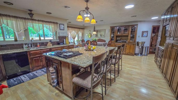 Dining room, Fireplace, Interior, Kitchen, Pendant Lights, Recessed Lighting, Wood Texture Flooring