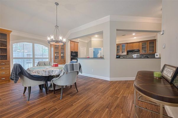 Chandelier, Dining room, Interior, Kitchen, Pendant Lights, Recessed Lighting, Stainless Steel Appliances, Wood Texture Flooring