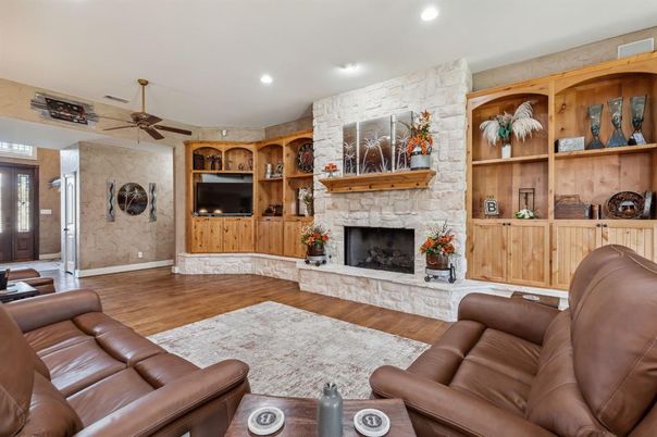 Fireplace, Interior, Living room, Recessed Lighting, Stone Walls, Wood Texture Flooring
