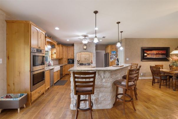 Dining room, Interior, Kitchen, Pendant Lights, Recessed Lighting, Stainless Steel Appliances, Wood Texture Flooring
