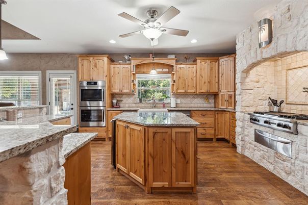 Interior, Kitchen, Recessed Lighting, Stainless Steel Appliances, Stone Walls, Wood Texture Flooring
