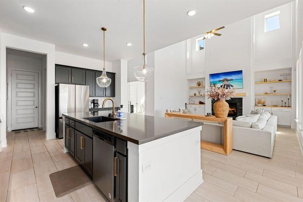 Fireplace, Interior, Kitchen, Living room, Pendant Lights, Recessed Lighting, Stainless Steel Appliances, Wood Texture Flooring
