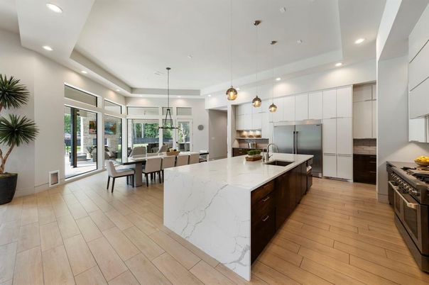 Dining room, Interior, Kitchen, Pendant Lights, Recessed Lighting, Stainless Steel Appliances, Wood Texture Flooring