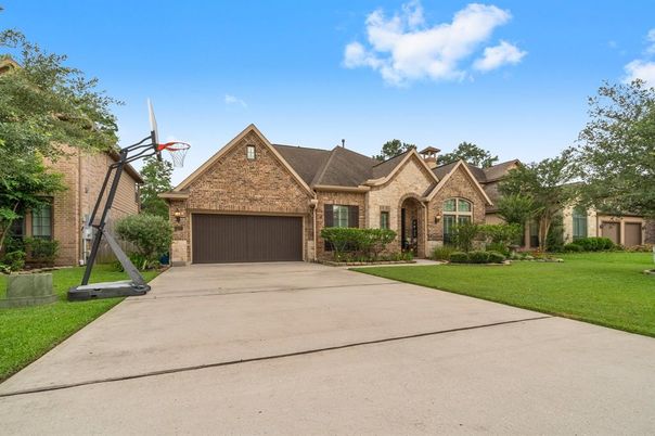 Attached, Backyard, Exterior, Facade, Brick Facade, Tudor Revival