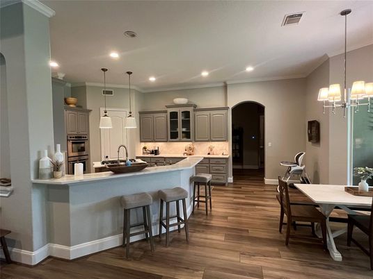 Dining room, Interior, Kitchen, Pendant Lights, Recessed Lighting, Stainless Steel Appliances, Wood Texture Flooring