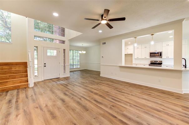 Chandelier, Empty room, Interior, Kitchen, Pendant Lights, Recessed Lighting, Stainless Steel Appliances, Wood Texture Flooring