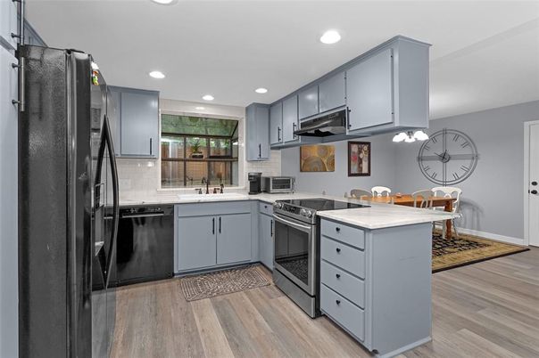Dining room, Interior, Kitchen, Recessed Lighting, Stainless Steel Appliances, Wood Texture Flooring